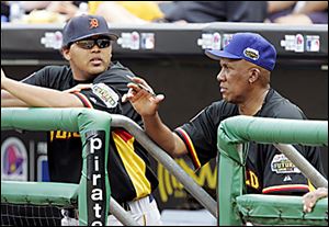 World manager Ferguson Jenkins, right, talks with All-Star Futures Game starter Humberto Sanchez of the Mud Hens.