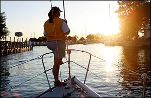 Liz Swisher keeps an eye on the dock during sunset.