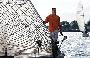 Nathan Derry looks out from the sailboat Wildcat.