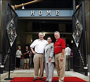 Joe Zerbey, left, with Carolyn Bivens and Jim Muray at Fifth Third Field at the Tuesday evening party.