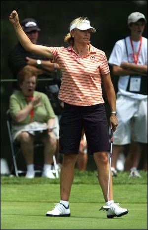 First-round leader Liselotte Neumann reacts after making a birdie on the fourth hole at Highland Meadows Golf Club in Sylvania.