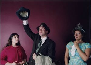 Elwood P. Dowd (Steve Copps) places a hat on his invisible friend, Harvey, as niece Myrtle, left
(Britney Koser) and sister Veta (Heather Williams) react in a scene from Harvey.