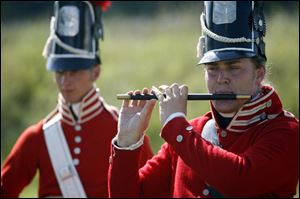 Eric Wallace plays the fife backed up by Tim Schulte on the drum. They wear period U.S. Army uniforms. 