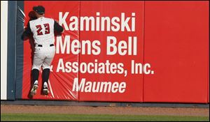 Dustan Mohr makes a catch before crashing into the wall, but the Hens seem to have their backs against the wall lately.