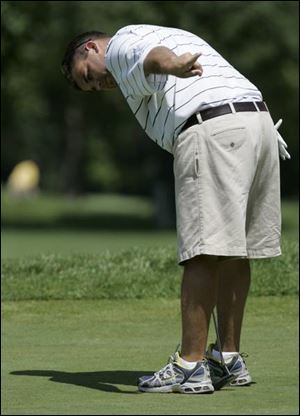 Kevin Kornowa tries to direct this putt a bit to the left yesterday at Inverness Club in the final round of the Toledo District Golf Association Stroke Play Championship. Kornowa managed three birdies in his round of 71 to win the event for the fourth time, including last year.
