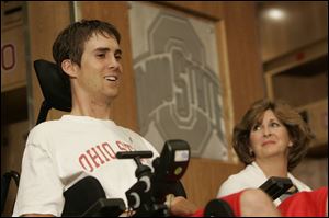 Tyson Gentry of Sandusky makes his first public appearance with his mother, Gloria, 3 1/2 months after breaking his neck.