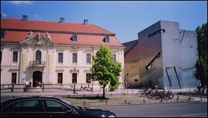 The Jewish Museum's gleaming new wing, right, contrasts sharply with the old building.