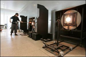 Glassblowing instructor Robin Schultes works with molten glass at the new Glass Pavilion.