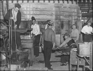 Workers get down to business in 1938 at the Libbey Glass factory in Toledo.