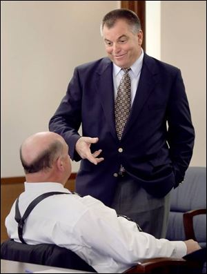 Tom Noe talks with William Wilkinson, one of his attorneys.
The former coin dealer had a pretrial session yesterday.
