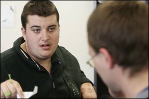 Jeff Wilson, who is autistic, interacts here with Allen Rawlins at Bittersweet Farms. Autism is the fastest growing disability in the nation.