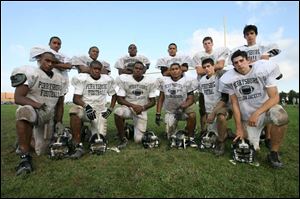 From left, front and back, Corey and Jamall Bias, Dominik and Gabe Grayson, Ore and T.J. Fatinikun, Dan and Derrick Garcia, Weston and Grant Klinksiek, and Corey and Kyle Szczublewski see a lot of each other on the football field at Perrysburg ... and at home as well.