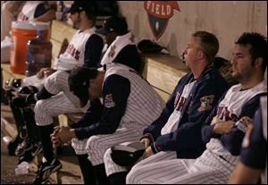 Mud Hens players react to last night s loss to the Rochester Red Wings, which puts the Wings ahead 2-1 in the series for the Governors  Cup. Brian Boehringer, center with head down, is scheduled to pitch tonight s game at Fifth Third Field, which the Hens must win to stay in the series. With him are last night s losing pitcher, Eulogio De La Cruz, behind Boehringer; Jason Karnuth, second to right, and John Ennis, foreground. 