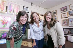 Artists Nannette Sturtevant of Delta, from left, Julie Baumker and Nancy Jean of Perrysburg display work in the gallery.