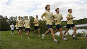 St. John s Jesuit s cross country team, running in packs as it often does in meets, is led at practice by (front, from left) Matt Lemon, Joe Miller and Chris Lemon, followed by (from left) Brett Wagner, Ben Schoonmaker and Chris Madaras. 