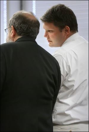 Patrick Carr, right, confers with his attorney, Paul Frankel, during the sentencing hearing.