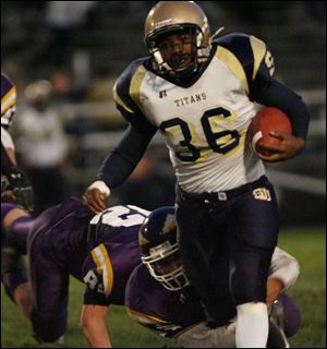 St. John's Allen Crews gets tackled low by Waite's Everardo Aldana and Andrew Rich. The Titans outgained Waite 373-111 in total offense and the defense forced four turnovers. 