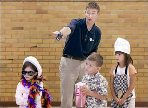 Instructor Burke Wilson shows Hannah Timko, from left, Thomas Leidel, and Hanna Revels the right thing to do on the Internet durng a safety program.