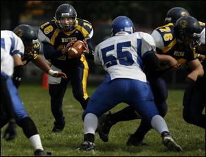 Whitmer junior quarterback Donnie Dottei has thrown for 704 yards, completing 47 of 90 passes, and has rushed for 331 yards.
