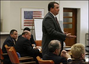 Defense attorney John Mitchell, above, questions a potential juror in Tom Noe's criminal trial. 
