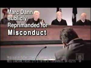 Justices played by actors scold Betty Montgomery's attorney- general opponent, Marc Dann, who is also played by an actor.