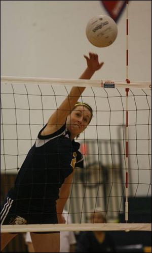 Busch s path is to UM as she keeps Toledo Christian on winning road Maggie Busch of Toledo Christian spikes the ball against Notre Dame.