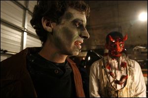 Ryan E. Smith, left, and Tom Sluder, Jr., are prepared to scare.