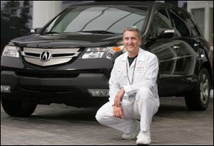 Frank Paluch with the 2007 Acura MDX sport-utility vehicle, introduced at U.S. dealerships on his 42nd birthday