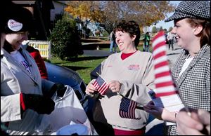Robin Weirauch, center, campaigns during the Old Fort Halloween parade in Old Fort, Ohio, the hometown of U.S. Rep. Paul Gillmor. Ms. Weirauch is trying to unseat Mr. Gillmor from the 5th District post. 