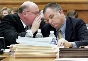 Defense attorney Bill Wilkinson talks to Tom Noe during the trial of the former coin shop owner and GOP fund-raiser. Noe is accused of embezzling from a workers  comp bureau investment.

