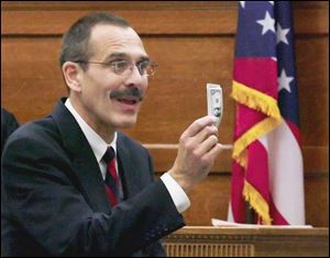 Larry Kiroff, assistant Lucas County prosecutor, tells jurors that Tom Noe ran a shell game. 