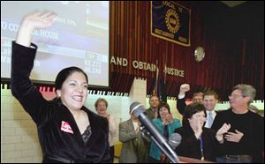 Antia Lopez, the Democratic challenger for Lucas County auditor, greets supporters at the
headquarters of United Auto Workers Local 12 last night.