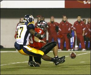 Toledo linebacker Steven Morrison sacks Northern Illinois quarterback Phil Horvath, causing a fumble which the Rockets
recovered. The Rockets (4-6, 2-4 in the MAC) held the Huskies  Garrett Wolfe to 54 yards rushing on 16 carries.
