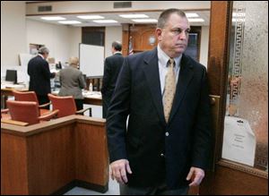 Tom Noe leaves the courtroom after the jury begins weighing evidence from his trial on charges of stealing millions of dollars from the Ohio Bureau of Workers' Compensation.