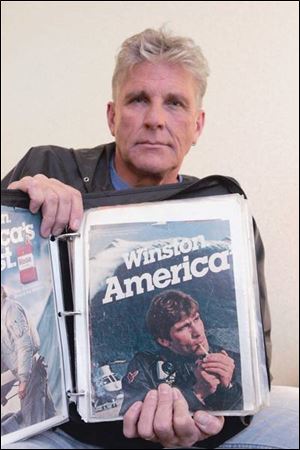 Dave Goerlitz shows Winston Cigarettes advertisements that, he said, were used to tempt teens into smoking.