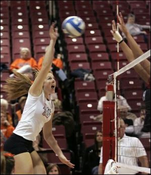 Madeline Means takes aim at the ball before she nails a spike for Bowling Green State University
in its match yesterday at the SeaGate Centre against Ball State.