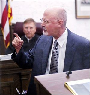 Defense attorney Richard Drucker cross-examines a witness during the Gravelles' trial for child endangering. 'caged kids' TRIAL