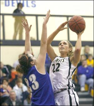 Anthony Wayne's Jordyn Sadowski defends against Perrysburg's Nicole Parrish. Parrish scored 25 points.