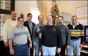 Among those watching the Army-Navy football game at the home of Bob Oehlers were, from left, Jim Kelly, Steve Heaney,
John Chapman, Don Hendershot, Mr. Oehlers, Ralph Zychowicz, and Bruce Foster. All are West Point graduates.
