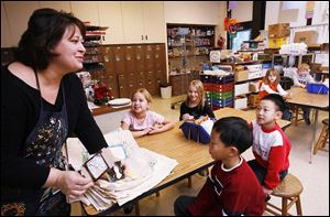 Jennifer Bucher talks in class with, from left, Madeline Crandall, Cassie Arvay, Joshua Park, and Billy Fong.