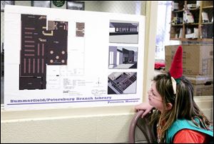 Brianna Breitner takes a look at the future of the Monroe County library branch. The expansion plans were on display during a holiday celebration at the building in Petersburg.