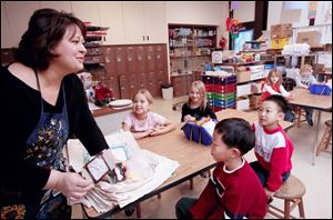 Jennifer Bucher talks in class with, from left, Madeline Crandall, Cassie Arvay, Joshua Park, and Billy Fong. 