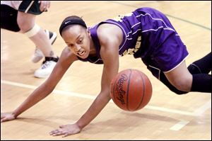 Shareese Ulis dives for a loose ball last night at Start. The two-time City League player of the year scored 10 of her 30 points in the final six minutes to lead a Waite comeback.