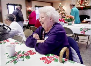Ethel Trimmer has a laugh with a fellow former Tiedtke employee at the department store reunion.