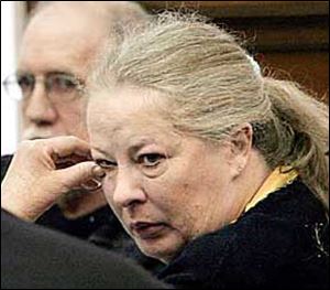 Michael Gravelle, left, looks at his wife, Sharen, after the verdicts were being read in their abuse trial.