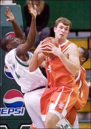 BGSU's Matt Lefeld, right, hauls in a rebound, as Marshall's Jean Francois Bro Grebe comes up empty-handed.