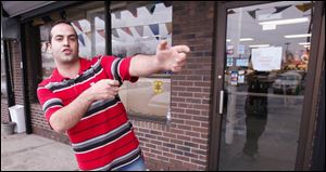 Adnan 'Eddie' Awad describes how he thwarted an attempt by three men to rob his South Toledo clothing store.