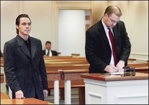 The Rev. Michael Pitts attends the hearing with his attorney, Stephen Hartman, right.