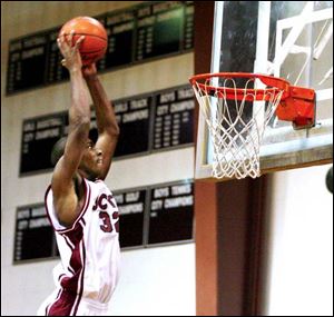 Scott's Chris Wyse makes good use of a Kenny Hairston alley-oop pass in the second quarter against Findlay last night at Scott.