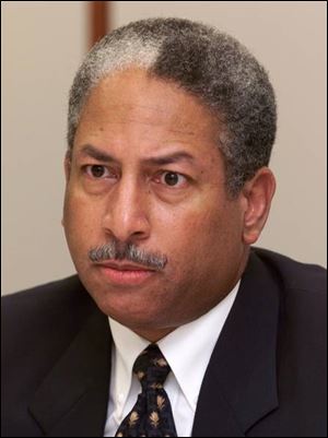 Robert Redmond owes the city $88,863, a debt Mr. Redmond, a University of Toledo trustee, says he will repay.